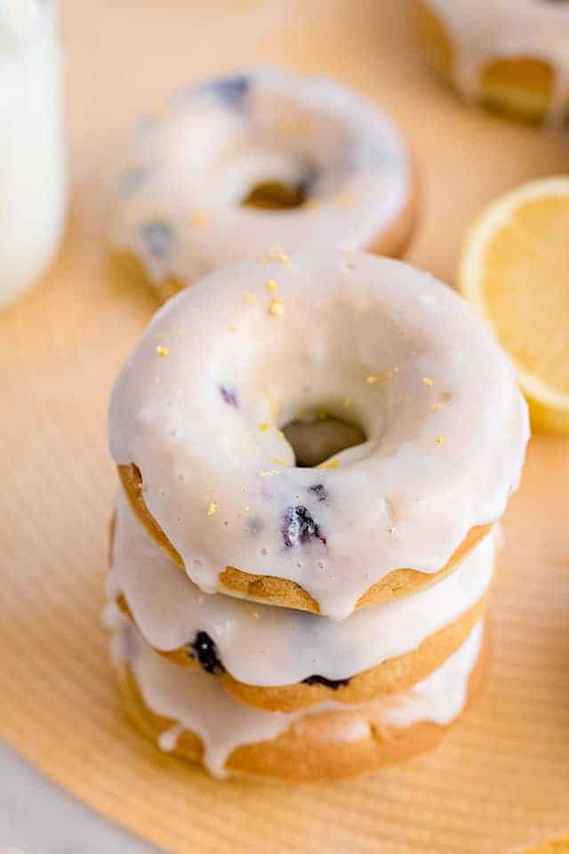 stack of donuts on a yellow placemat