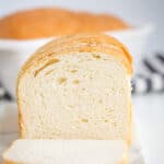 A homemade loaf of bread on a cutting board.