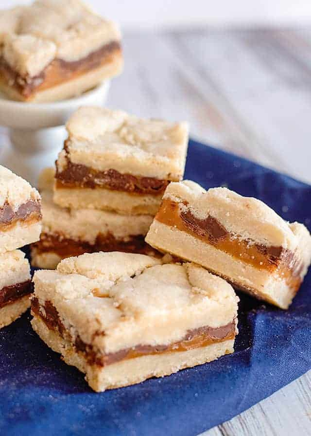 bar propped up on another shortbread bar with a blue linen underneath it