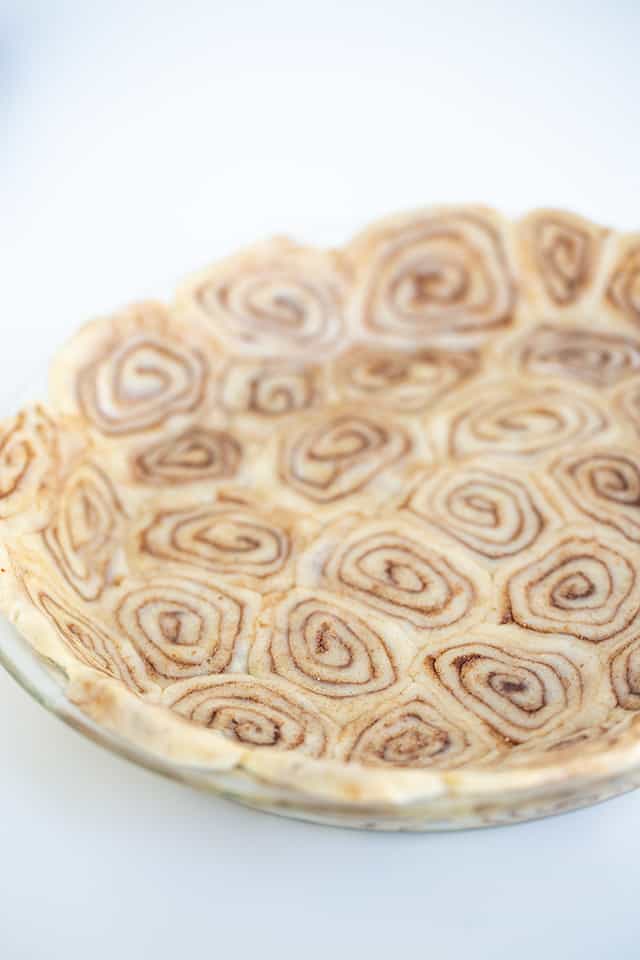 pie crust in a pie plate with a white background