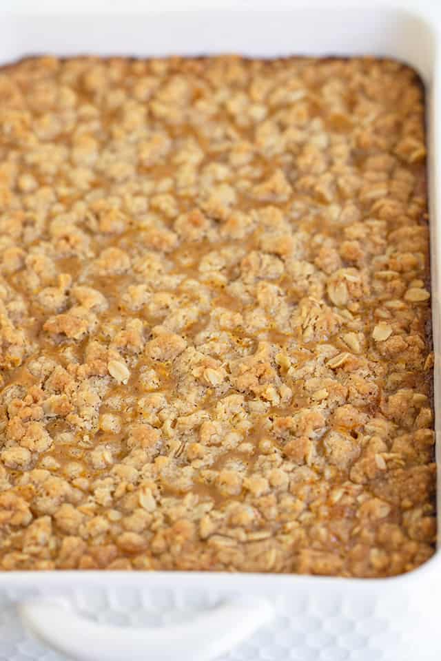 close up of a white pan full of pumpkin crisp