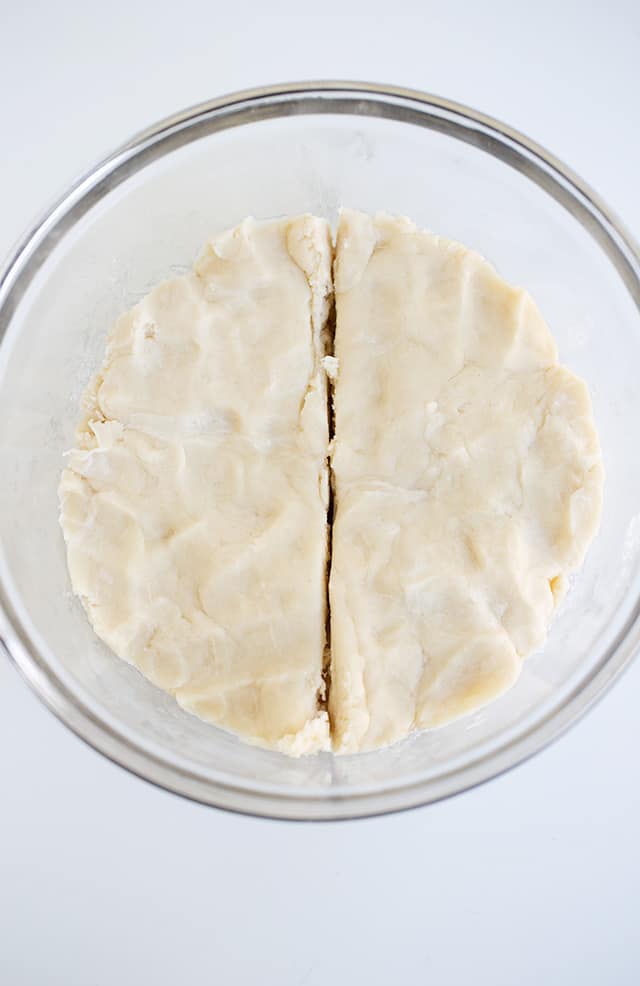 pie crust dough cut in half for cinnamon roll crust
