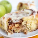 A slab of apple cinnamon roll on a dish.