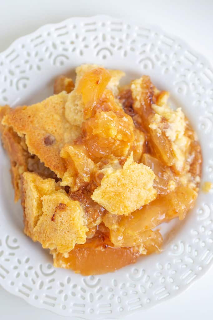 overhead photo of dump cake piled on a white dessert plate