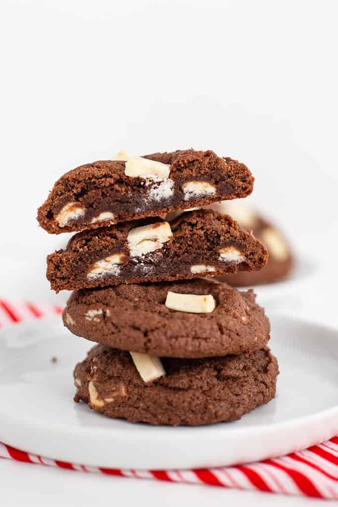 stack of cookies with the top one sliced in half showing the inside