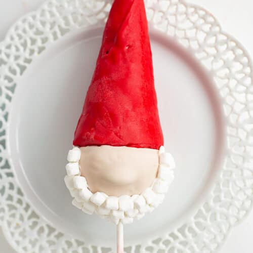 gnome cake pop on a white lace plate