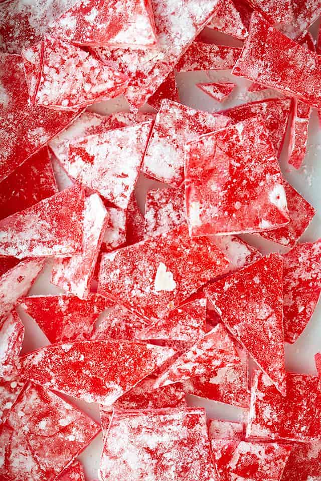 overhead photo of the red rock candy scattered in a shallow white pan