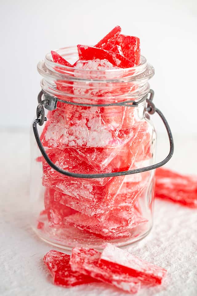 hard candy in a mason jar and sitting on the white background