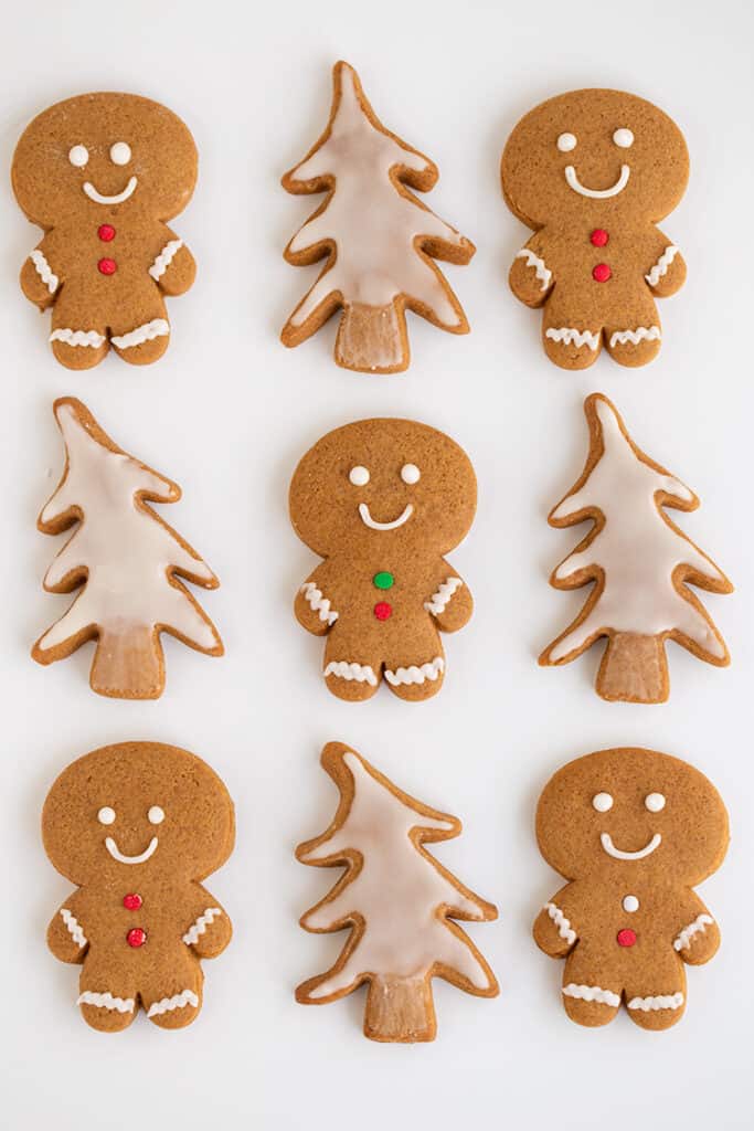 gingerbread cookies layed out on a white surface