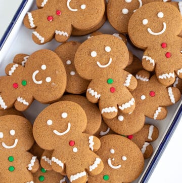 gingerbread cookies stacked in a white pan