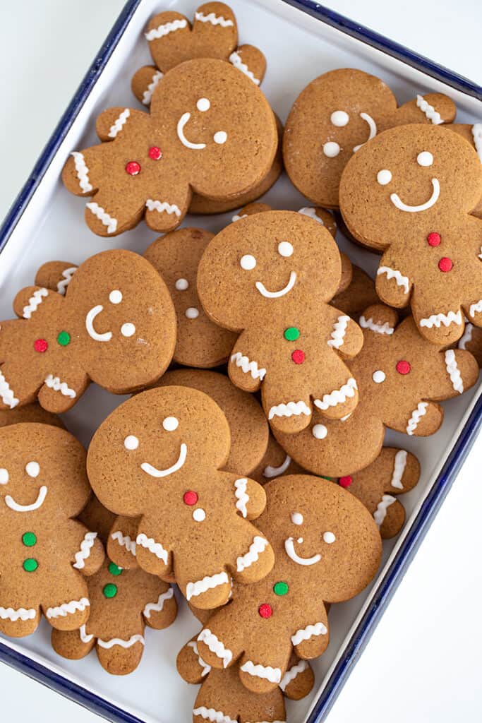 gingerbread cookies stacked in a white pan
