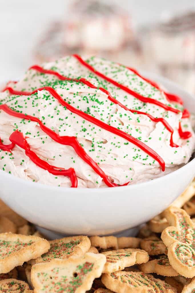 close up of the dip with holiday cookies under the bowl