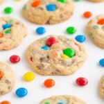 photo of cookies on a white background with m&m candies around the cookies