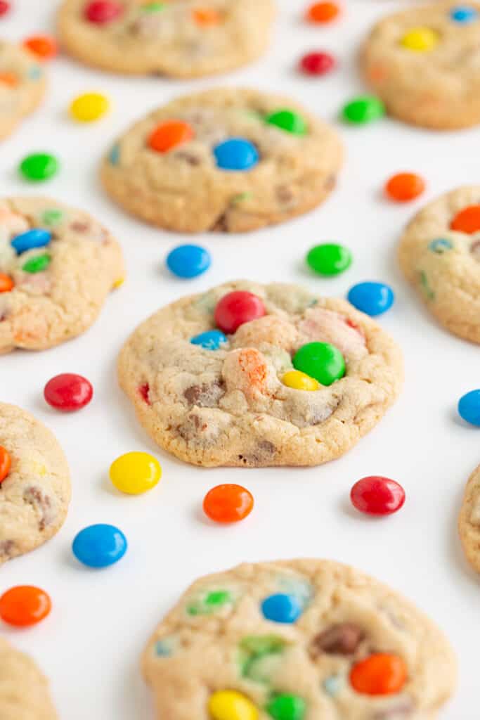 photo of cookies on a white background with m&m candies around the cookies