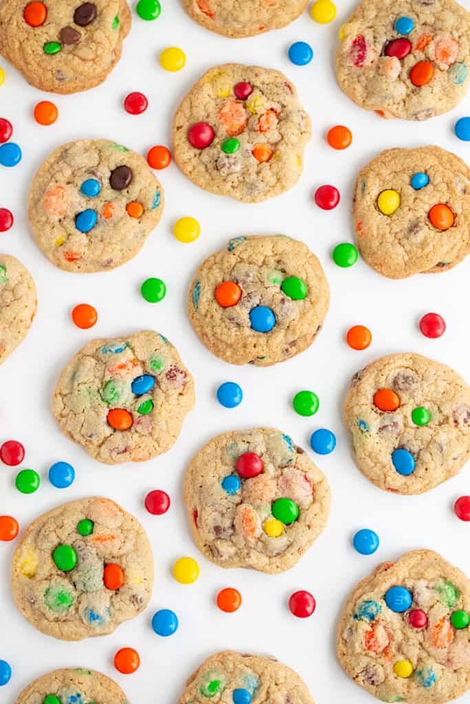 overhead photo of m&m cookies with M&M candies around the cookies