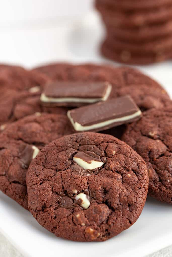 cookies on a white platter with candies on top of the cookies