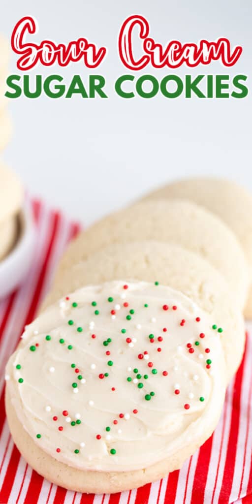 zoomed in photo of sugar cookies on a striped fabric with the recipe name in text at the top