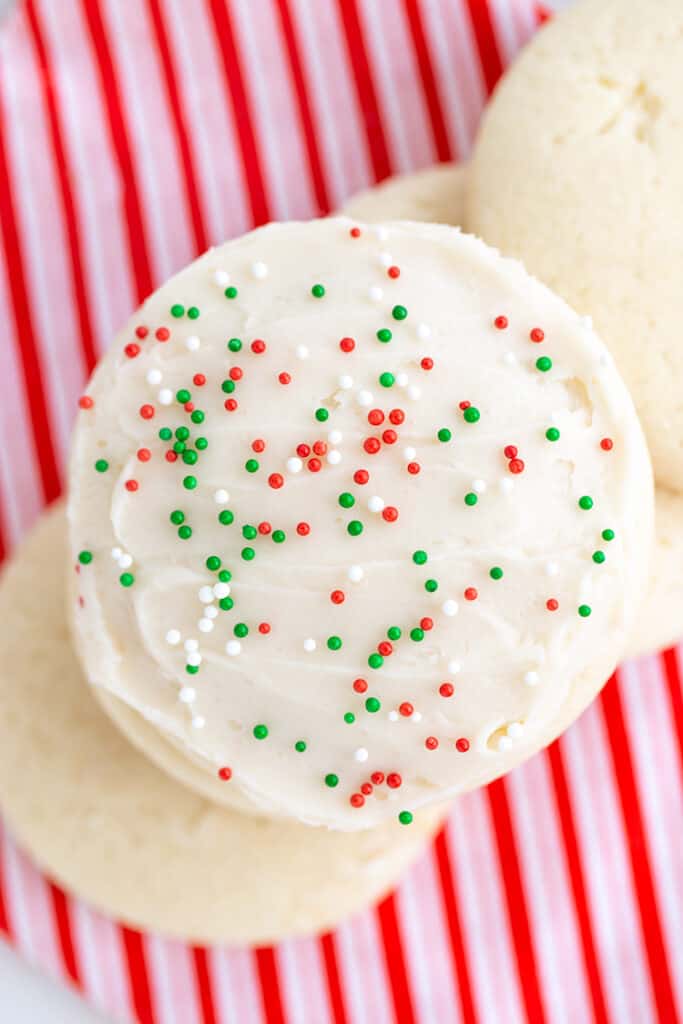 stacked sugar cookies on a candy cane striped linen