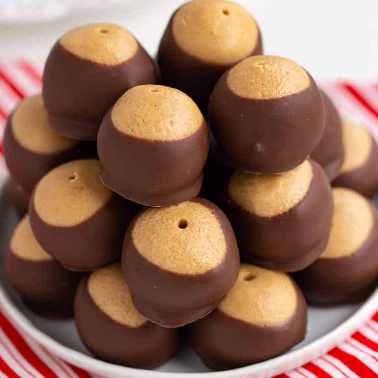 square image of a stack of buckeyes on a red and white fabric