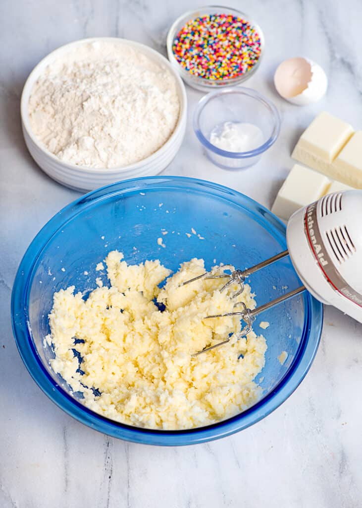 wet ingredients that have been creamed in a blue mixing bowl