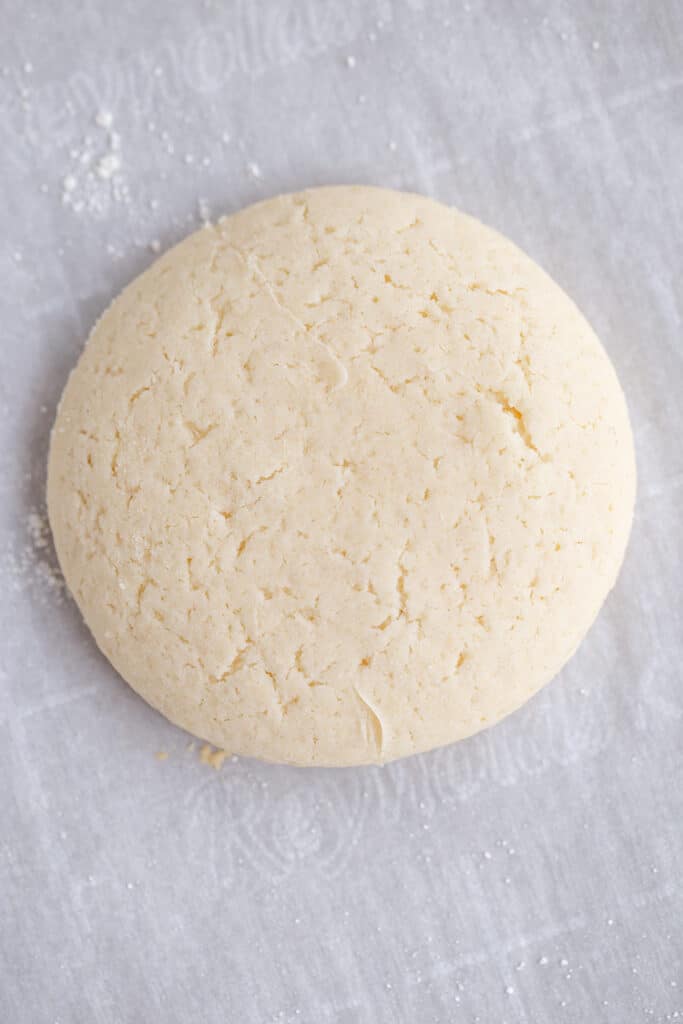 plain sugar cookies on a piece of parchment paper