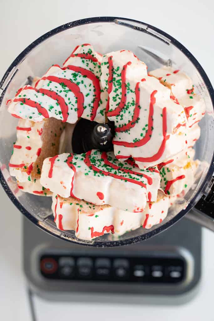 overhead photo of christmas tree cakes in a food processor