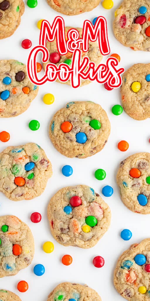 zoomed in overhead photo of cookies on a white background with candies scattered and text at the top