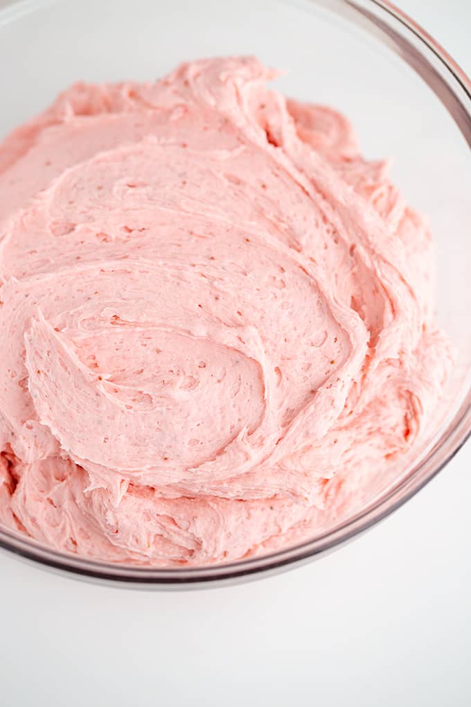 a glass bowl full of frosting