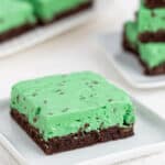 square image of a single brownie on a white plate