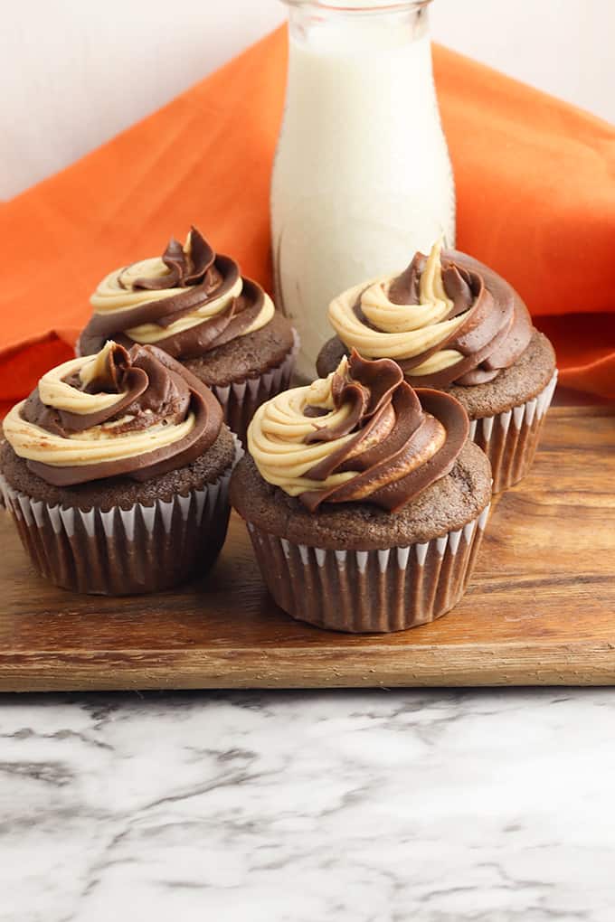 cupcakes on a wooden board with a marble backdrop