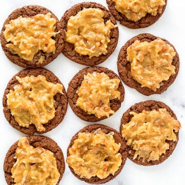 overhead photo of german chocolate cookies on a marble background