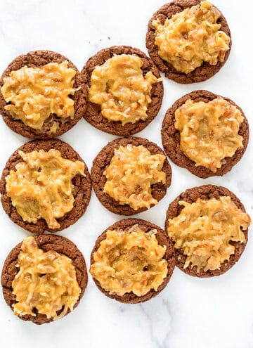 overhead photo of german chocolate cookies on a marble background