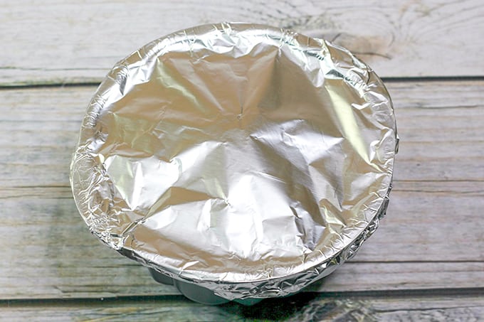 bundt pan covered with tin foil