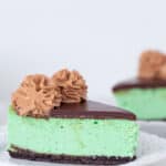 slice of green cheesecake on a white plate