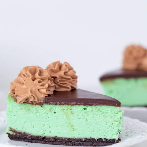 slice of green cheesecake on a white plate