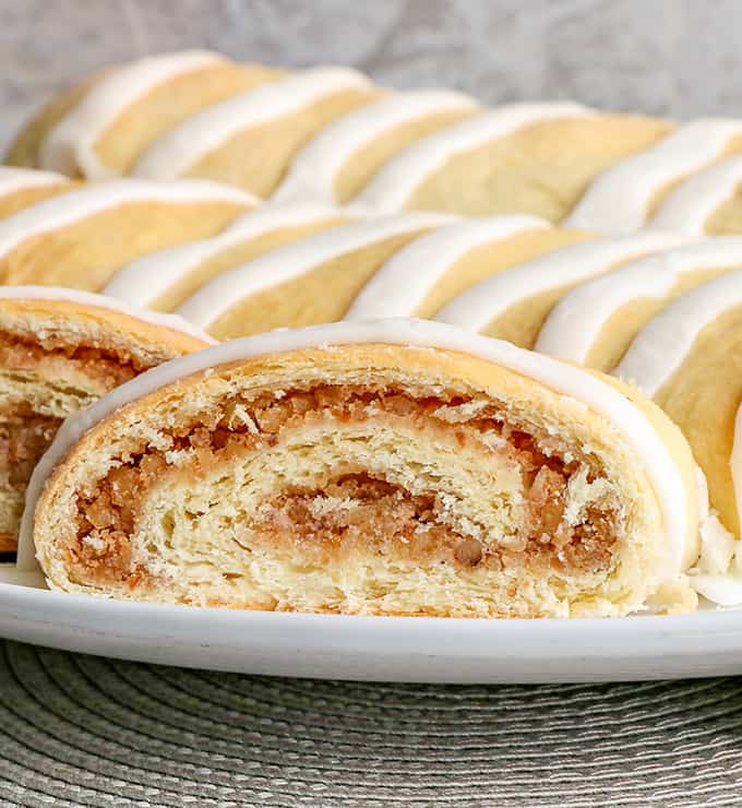 up close photo of the nut rolls showing the swirl of filling on a white platter 