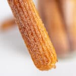 square image of holding the churro