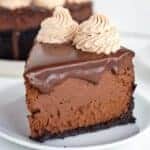 square image of a slice of cheesecake on a small white dessert plate
