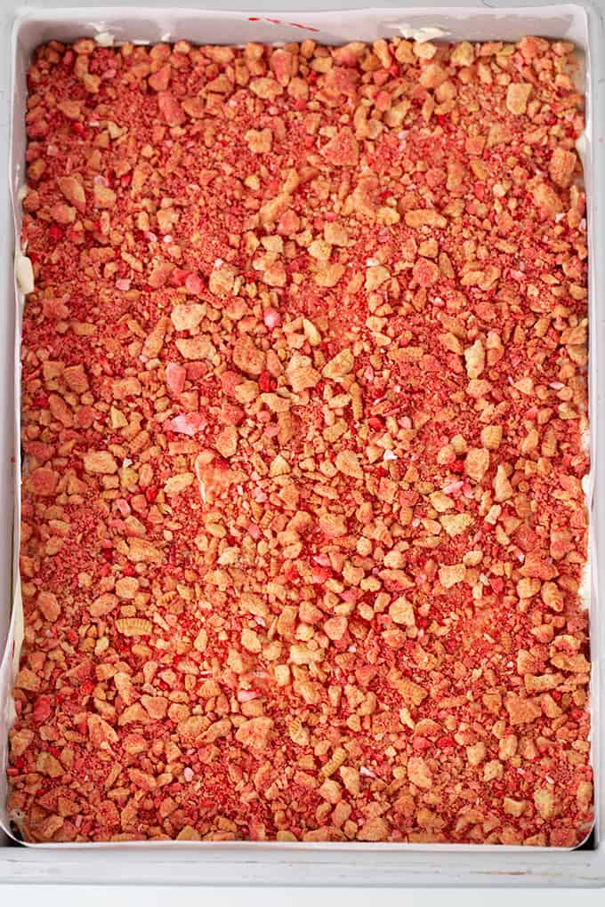 overhead photo of the strawberry crunch dessert in a 9x13 pan