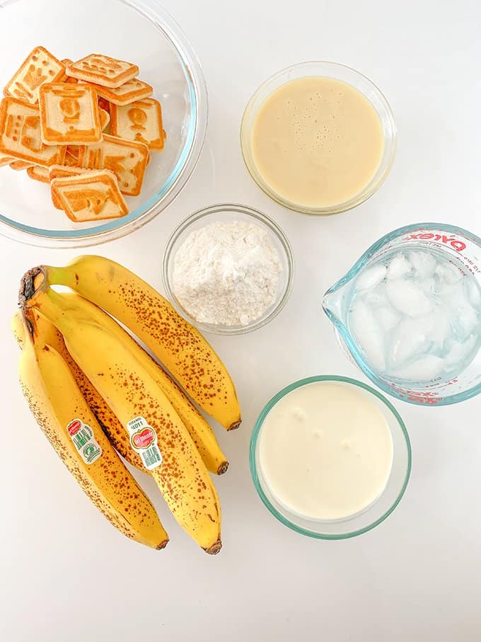 banana pudding ingredients on a white surface