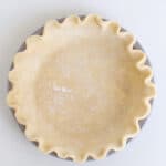 overhead view of a unbaked pie crust in a pan
