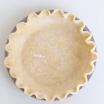 overhead view of a unbaked pie crust in a pan