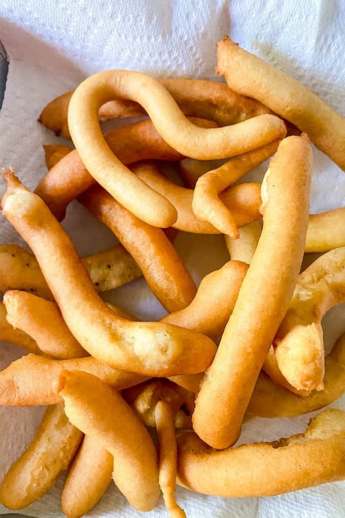 funnel cake fries on a paper towel draining