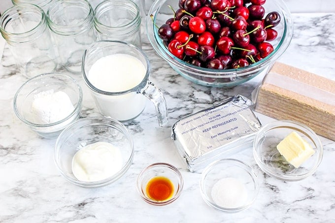 Ingredients on a marble background for no bake cheesecakes in a jar