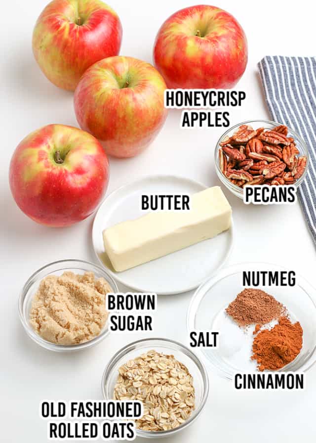 overhead image of ingredients laid out for baked apples on a white surface