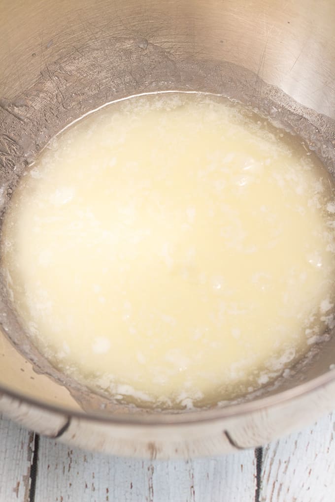 milk and shortening in a metal mixing bowl