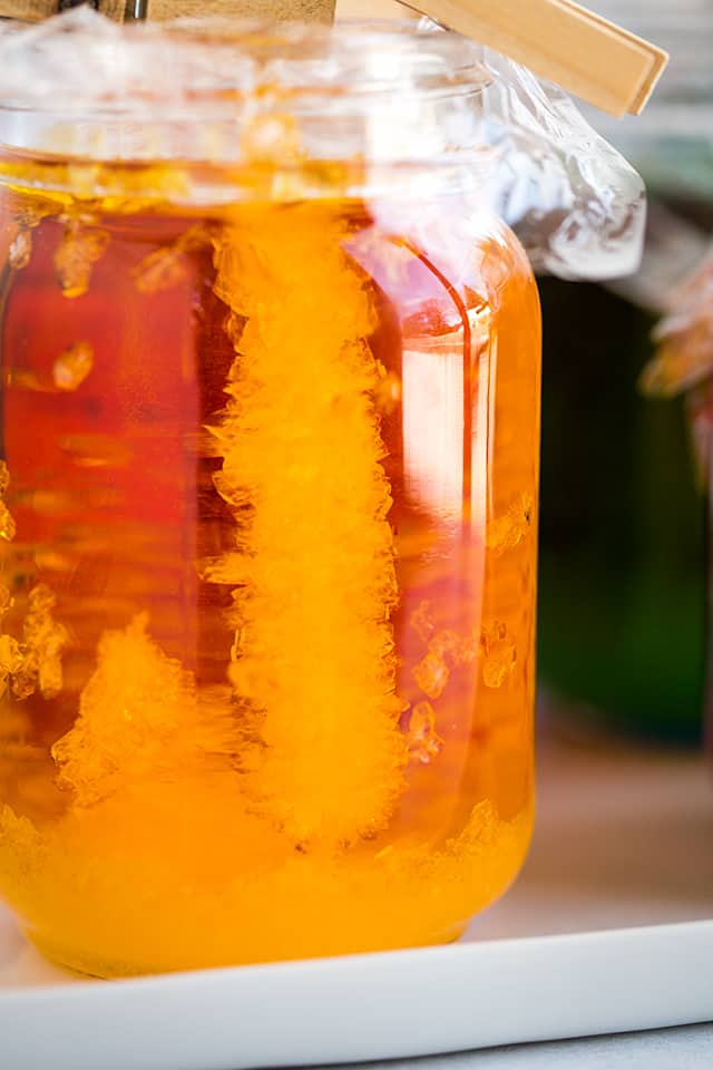 close up of the rock candy in a mason jar showing all of the rock candy crystals