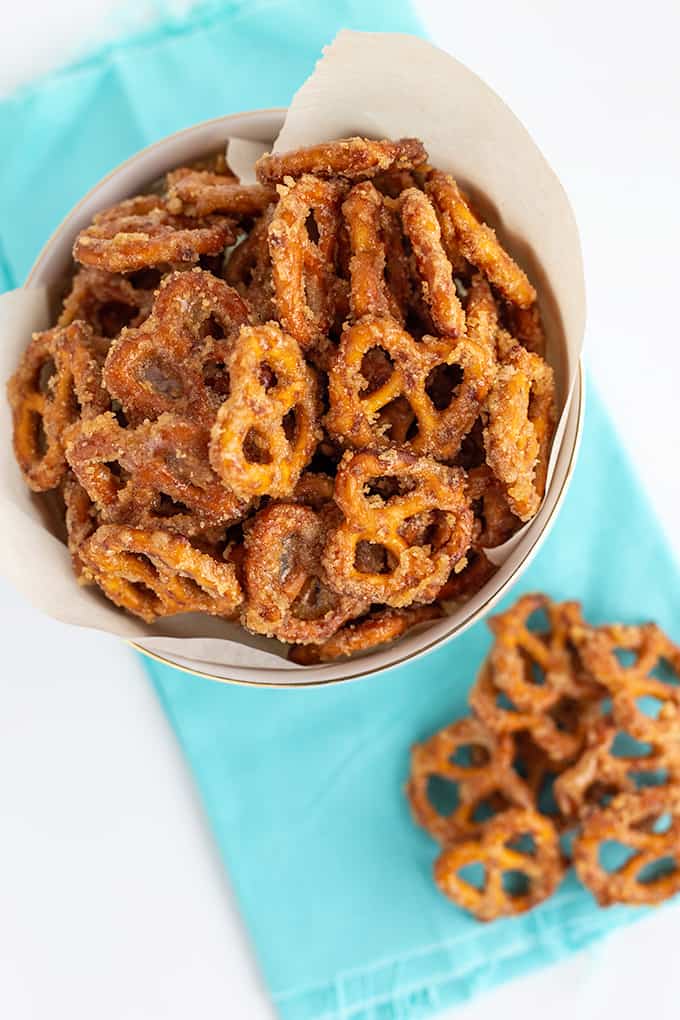 overhead photo of the pretzels in a white bowl with a light blue fabric under the bowl on a white surface