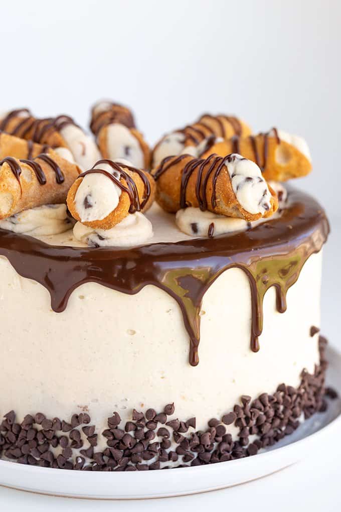 image of the whole cake on a white plate on a white surface