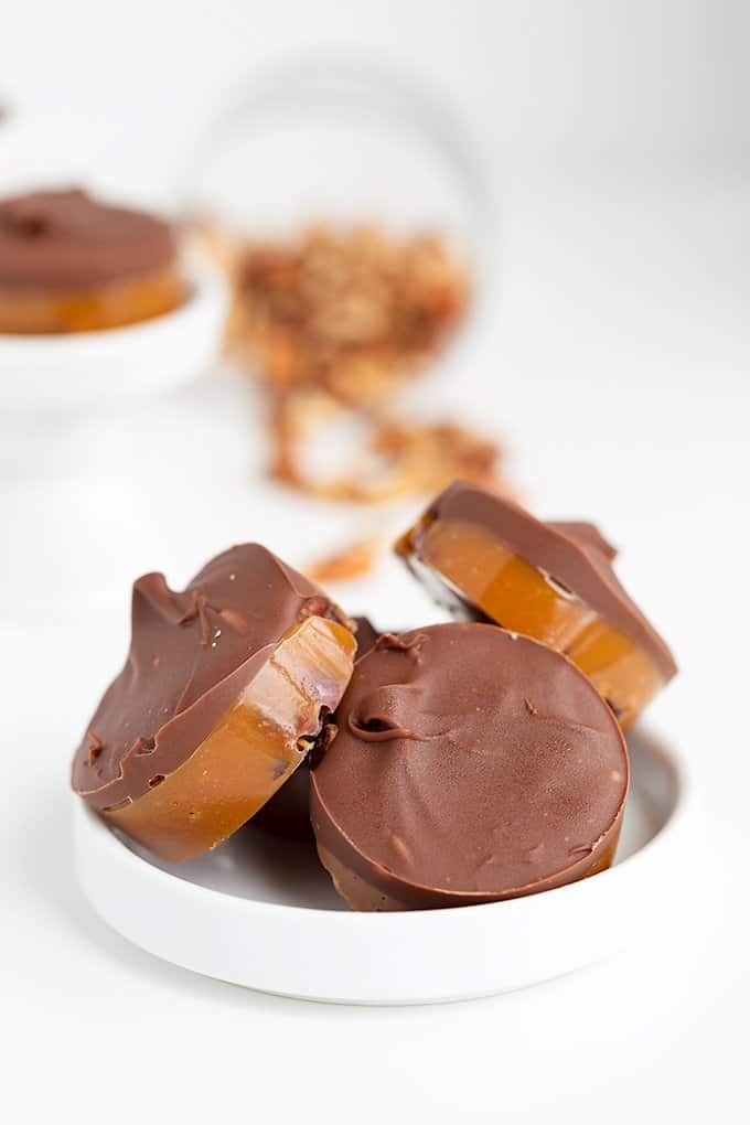 chocolate turtles on a small white plate